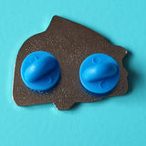 Sleepy Bear photo- shows back of badge with two blue rubber clutches